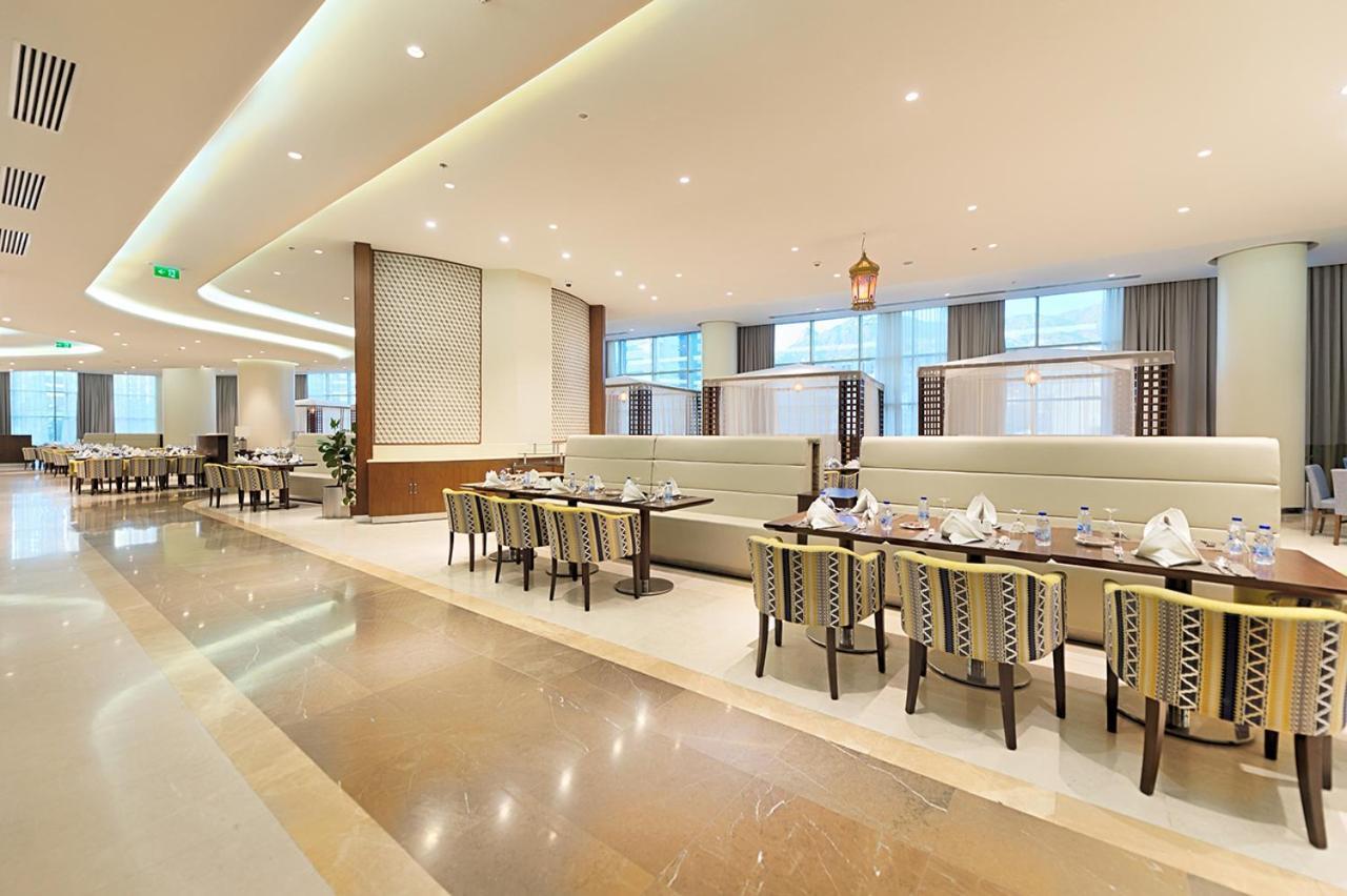 Holiday Suites Al Azizia Mekka Exterior foto The hotel's restaurant